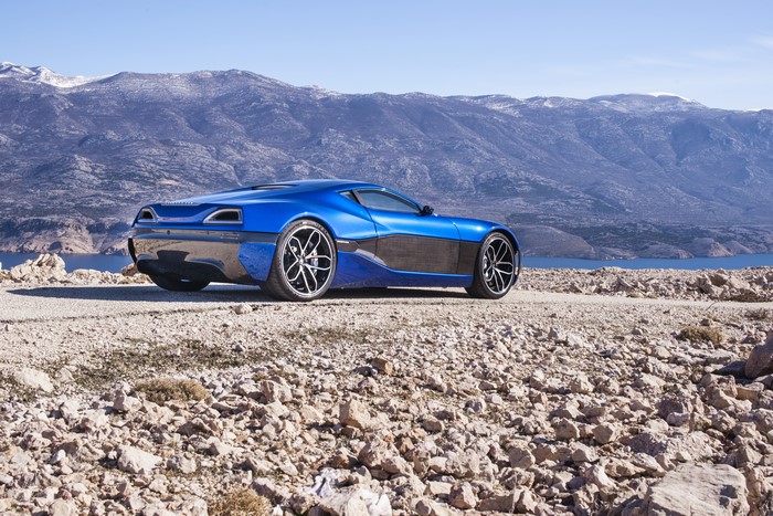 Blue 2014 Rimac Concept One on rocky terrain