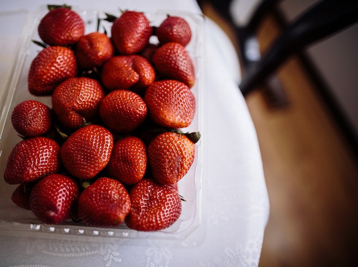 Strawberries in a clear plastic container