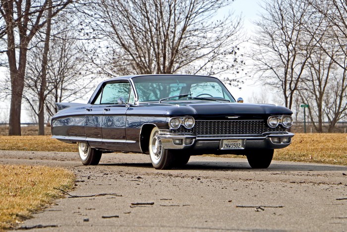 Dark Blue Cadillac Coupe de Ville on a Road