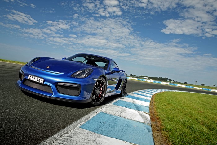 Blue Porsche Cayman GT4 on a Racetrack