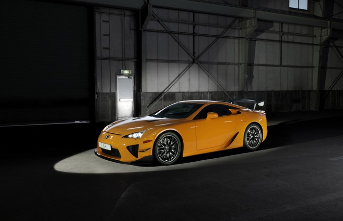 Orange Lexus LFA in a warehouse