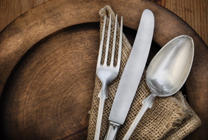 Knife, Spoon, and Fork on Wooden Plate