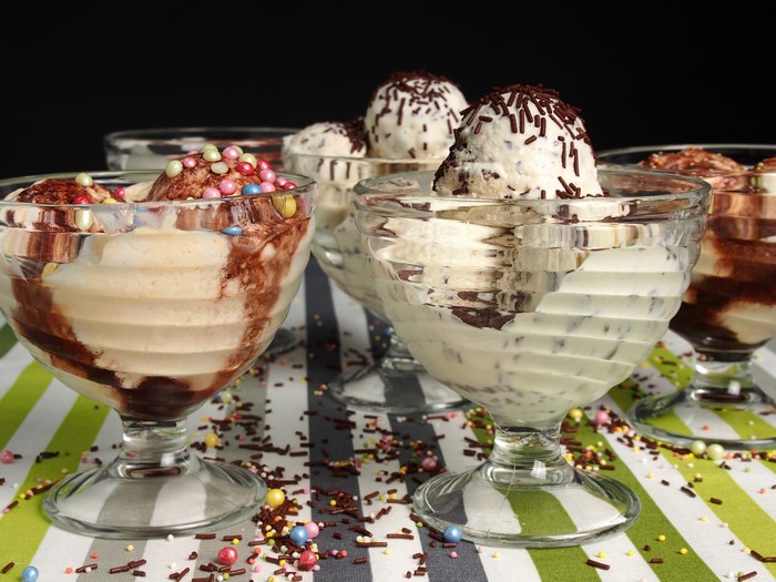 Ice cream sundaes with chocolate syrup and sprinkles