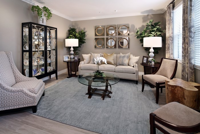 Living room with sofa, armchairs, and cabinet