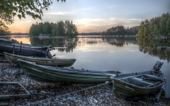 Boats on a lake at sunset