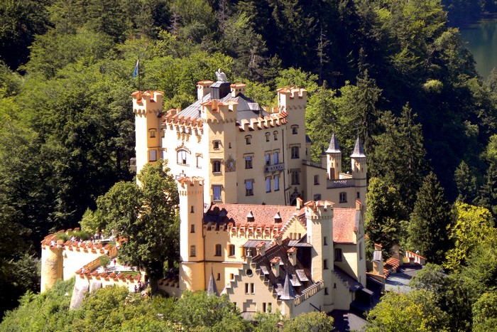 Hohenschwangau Castle surrounded by trees in Germany