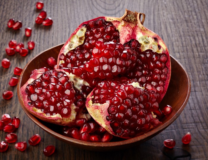 4K Pomegranate in Wooden Bowl