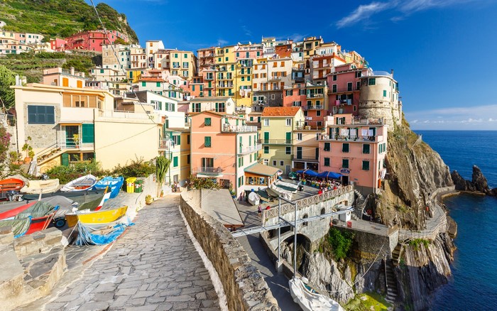 Manarola, Italy village on a cliffside with boats