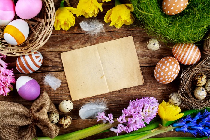 Easter eggs and flowers on a wooden table