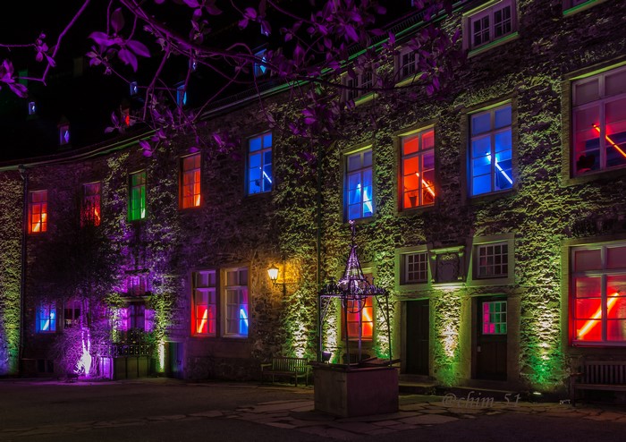 Drachenburg Castle at Night with Colorful Lights