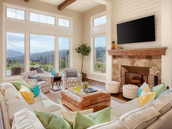 Living room with sofa, armchair, and fireplace
