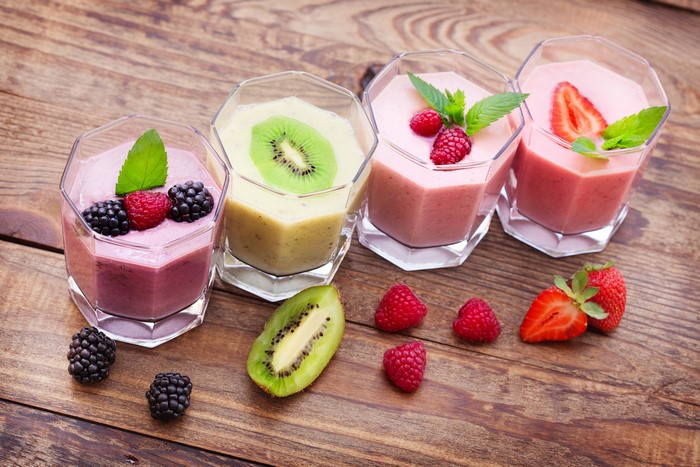 Four Fruit Smoothies with Berries and Kiwi