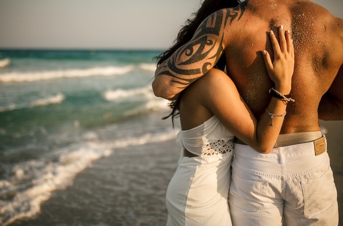 Couple hugging on a beach