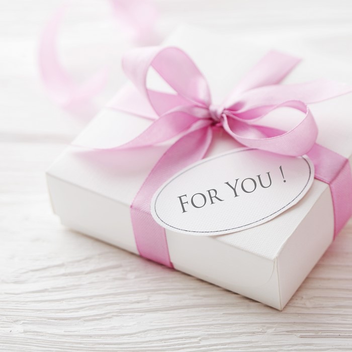 White gift box with pink ribbon and "For You!" tag