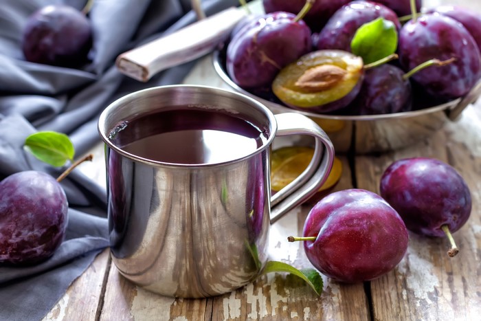 Plums and Plum Juice in a Mug