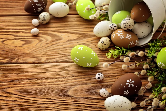 Easter Eggs on Wooden Table with Pussy Willows