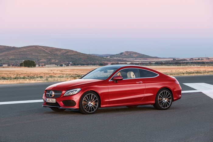 Red Mercedes-Benz C-Class Coupe C205 on a road