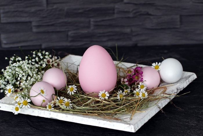 Easter eggs with camomiles on a tray