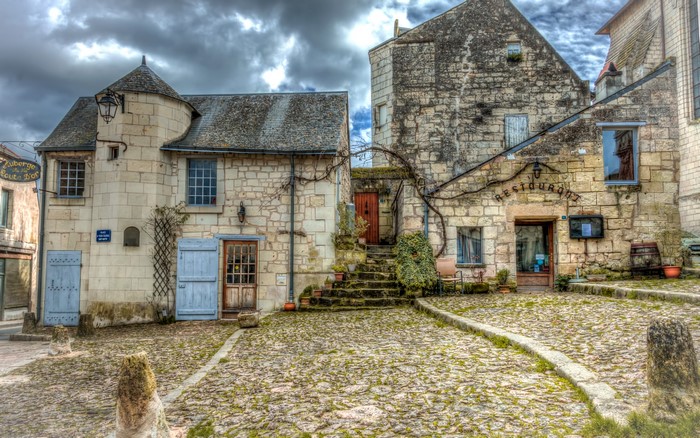 Stone buildings and cobblestone street in Candes-Saint-Martin, France