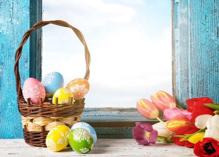 Easter Eggs in Wicker Basket with Tulips