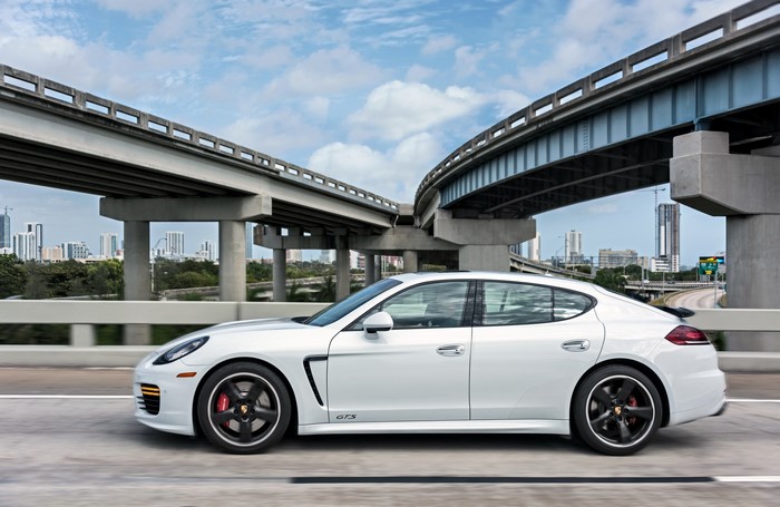 White 2014 Porsche Panamera GTS driving on highway
