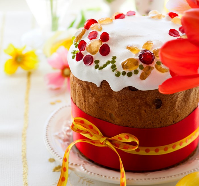 Easter Kulich pastry with icing and candied fruit