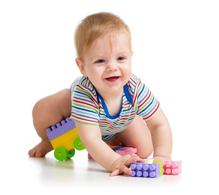 Baby playing with colorful toys