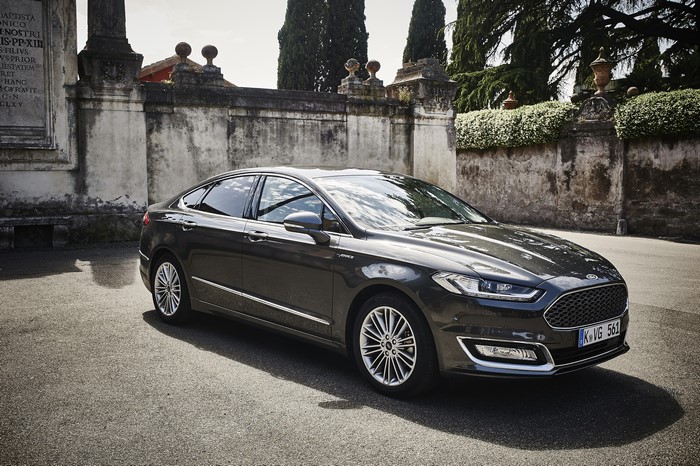 Ford Mondeo Vignale Sedan parked near a stone wall