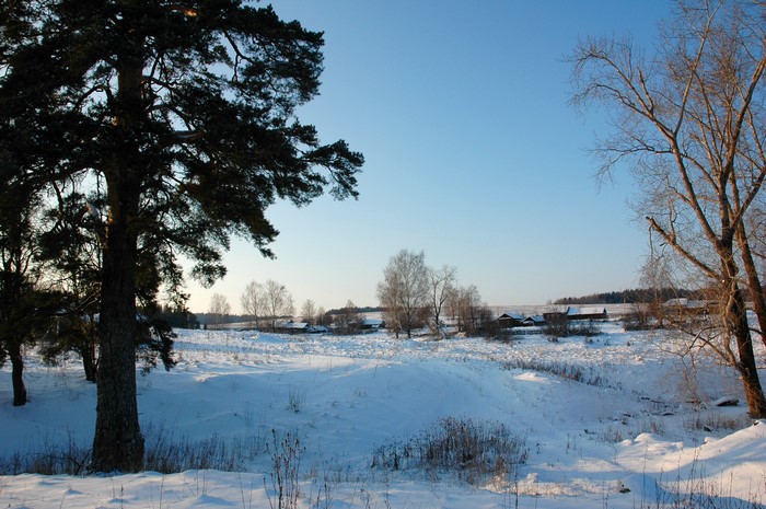 Winter village scene in Russia with snow