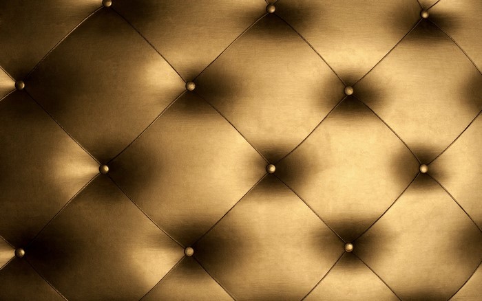 Gold tufted upholstery texture