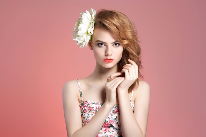 Woman with flower in hair and floral dress