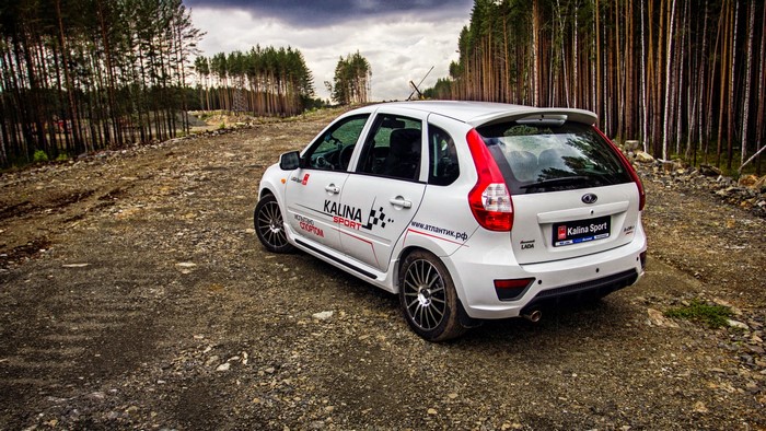 White 2014 Lada Kalina Sport 2192 on a dirt road