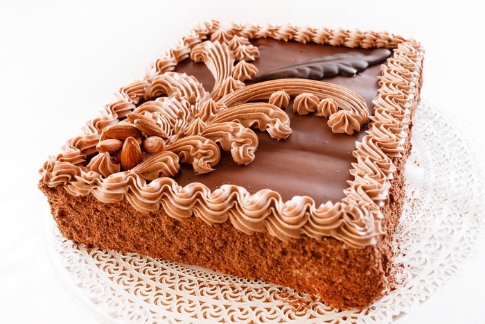 Chocolate cake with chocolate frosting and almonds