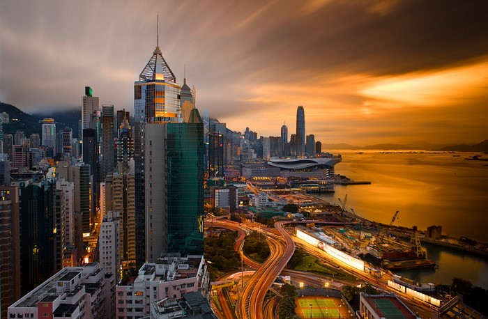 Hong Kong Skyline at Sunset with Harbor and Highways