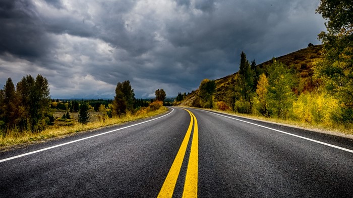 Winding Road Through Autumn Landscape
