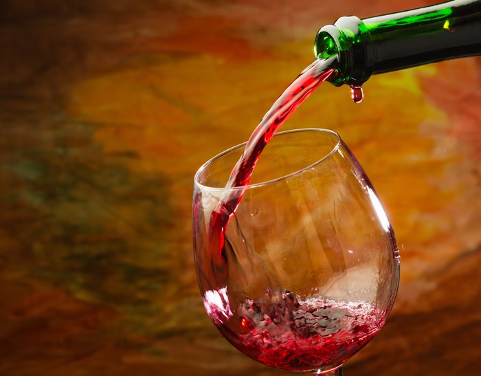 Red wine being poured into a glass