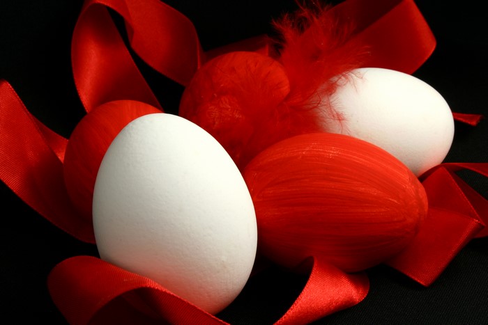 Easter Eggs with Red Ribbon and Feathers