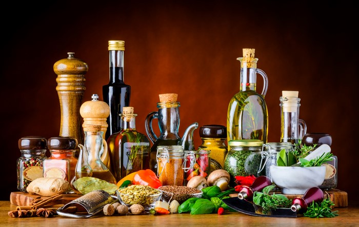 Collection of spices, oils, and vegetables