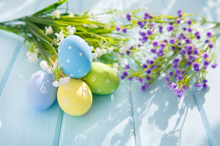 Easter Eggs with Flowers on Blue Wood