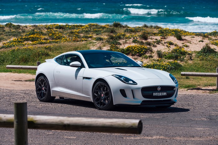White Jaguar F-Type Coupe by the Ocean