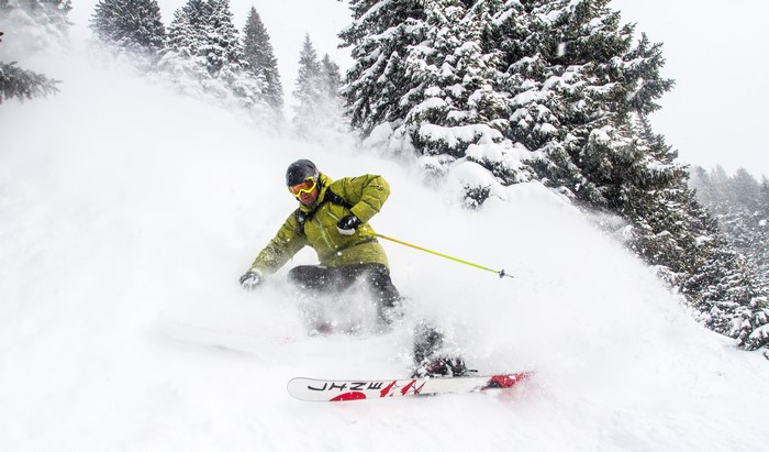 Man skiing down a snowy slope