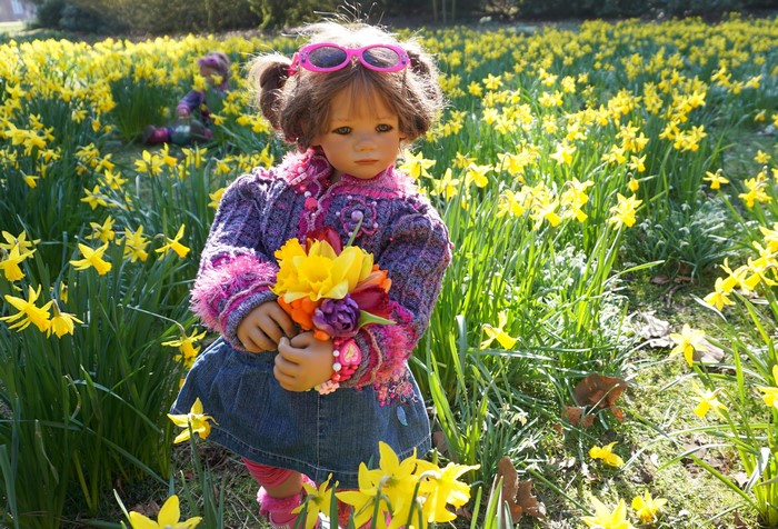 Doll in a field of daffodils at Grugapark Essen