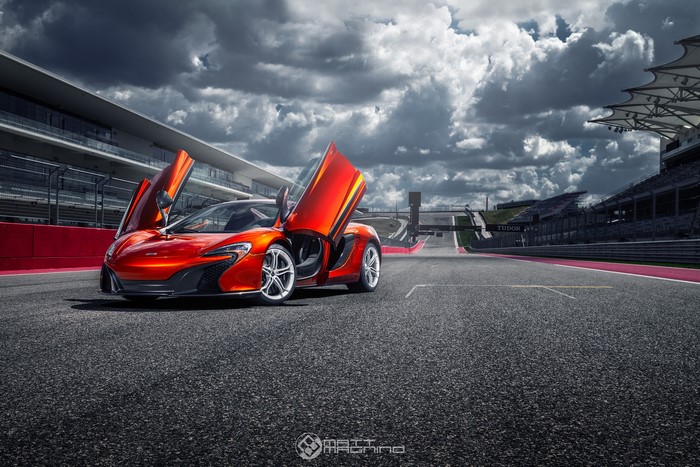 McLaren 650S with opened doors on a race track