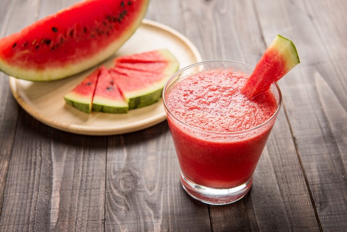 Watermelon slices and juice in a glass