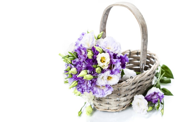 Bouquets in a wicker basket on a white background