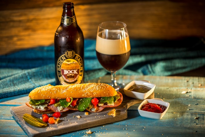 Baden Baden Bock beer with sandwich and condiments