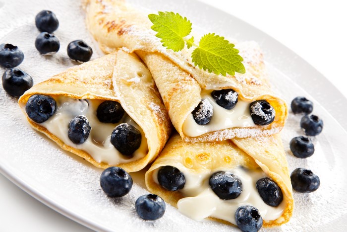 Pancakes with blueberries and cream