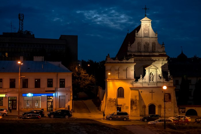 Church and buildings at night in Lublin, Poland