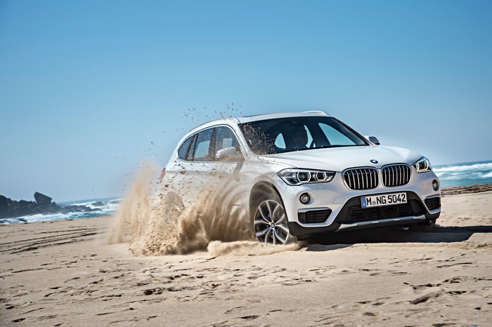 White BMW X1 xDrive xLine F48 on a Beach
