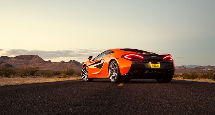 Orange McLaren 570S Coupe on Desert Road
